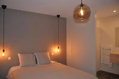 Un ou plusieurs lits dans un hébergement de l'établissement Gîte de la Foye - Le magnolia