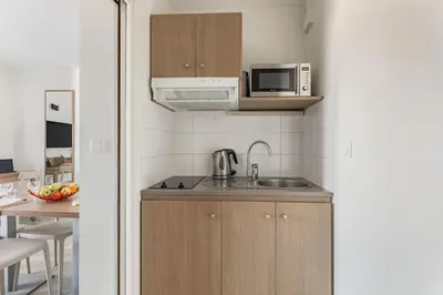 Cuisine ou kitchenette dans l'établissement Appart'City Confort Saint-Nazaire Océan