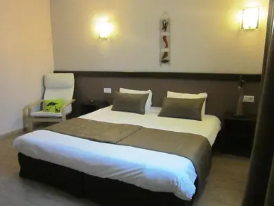 Un ou plusieurs lits dans un hébergement de l'établissement Hôtel Particulier VILLA DES MARAIS