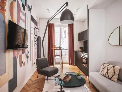 Télévision ou salle de divertissement dans l'établissement Maisons du Monde Hotel & Suites - Nantes