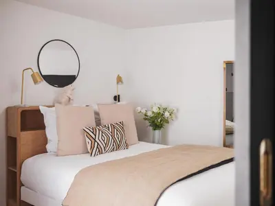 Un ou plusieurs lits dans un hébergement de l'établissement Maisons du Monde Hotel & Suites - Nantes