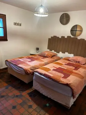 Un ou plusieurs lits dans un hébergement de l'établissement Capeden maison typique