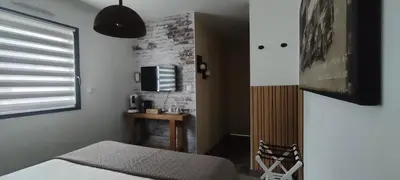 Un ou plusieurs lits dans un hébergement de l'établissement chambre d'hôte La Paisible