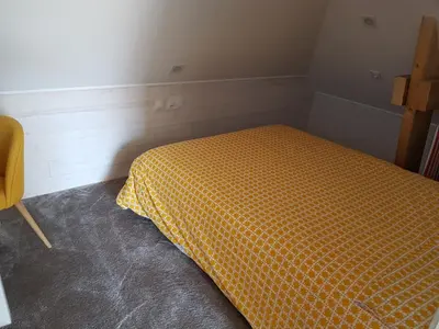 Un ou plusieurs lits dans un hébergement de l'établissement Angers Green Lodge - Yellow Sun Appartement