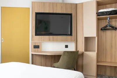 Télévision ou salle de divertissement dans l'établissement Brit Hotel Angers Parc Expo - L'Acropole