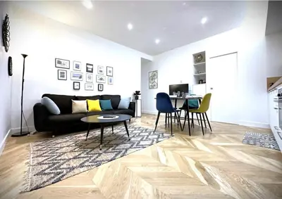 Coin salon dans l'établissement Hypercentre Charmant 2 Chambres Au Calme avec Joli Patio Privatif