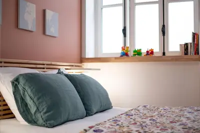 Un ou plusieurs lits dans un hébergement de l'établissement Hypercentre Appart 2 à 4 pers, Calme & Cosy avec Terrasse Privée