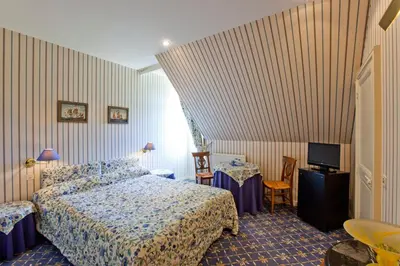 Un ou plusieurs lits dans un hébergement de l'établissement Château de la Verie