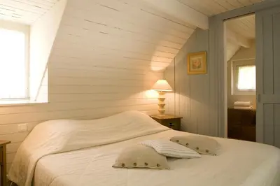 Un ou plusieurs lits dans un hébergement de l'établissement Cottages De La Bretesche