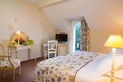 Un ou plusieurs lits dans un hébergement de l'établissement Cottages De La Bretesche
