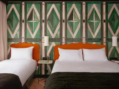 Un ou plusieurs lits dans un hébergement de l'établissement Chachacha Hôtel