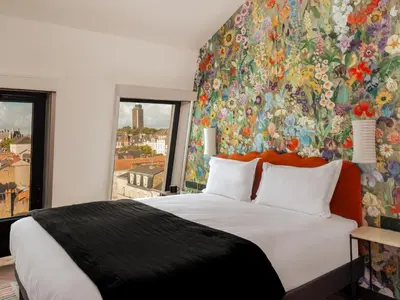 Un ou plusieurs lits dans un hébergement de l'établissement Chachacha Hôtel
