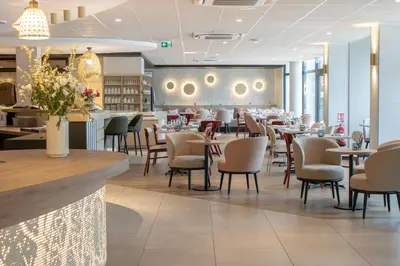 Coin salon dans l'établissement Brit Hotel Nantes La Beaujoire Parc Expo