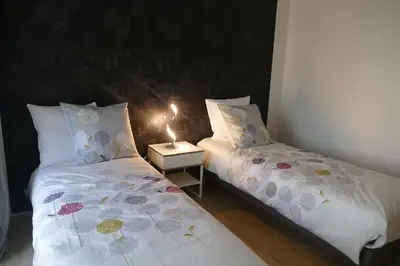 Un ou plusieurs lits dans un hébergement de l'établissement La Loge Bertine France