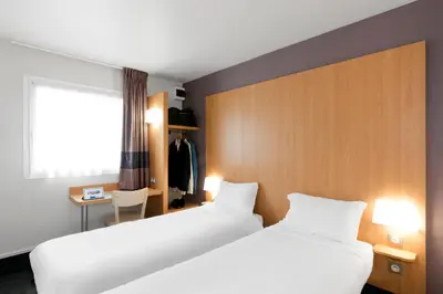 Un ou plusieurs lits dans un hébergement de l'établissement B&B HOTEL Nantes Aéroport