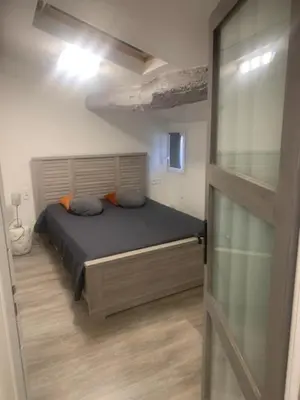Un ou plusieurs lits dans un hébergement de l'établissement Gite le port sur mer