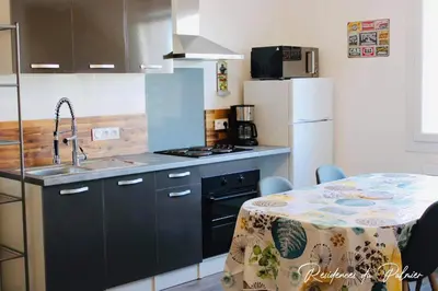 Cuisine ou kitchenette dans l'établissement Résidences du Palmier