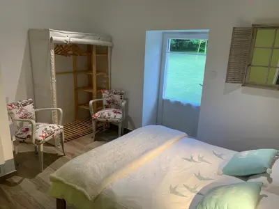 Un ou plusieurs lits dans un hébergement de l'établissement Chambres d'hôtes Logis Charrier Le Petit Bignon