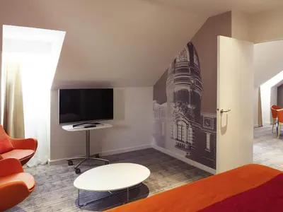 Télévision ou salle de divertissement dans l'établissement Mercure Nantes Centre Grand Hotel