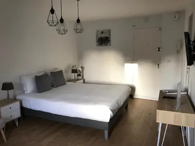 Un ou plusieurs lits dans un hébergement de l'établissement Hotel Abat Jour