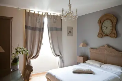 Un ou plusieurs lits dans un hébergement de l'établissement Hotel Abat Jour