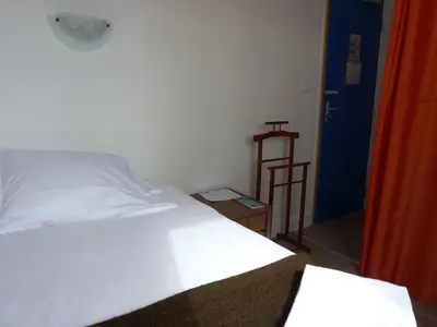 Un ou plusieurs lits dans un hébergement de l'établissement Hotel La Belle Etoile