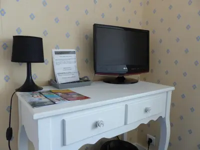 Télévision ou salle de divertissement dans l'établissement Hotel La Belle Etoile