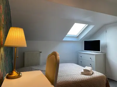 Un ou plusieurs lits dans un hébergement de l'établissement Hotel Saint Yves