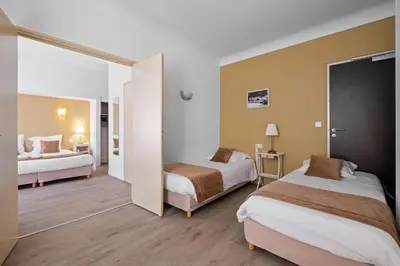 Un ou plusieurs lits dans un hébergement de l'établissement Hotel Saint Paul