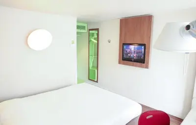Un ou plusieurs lits dans un hébergement de l'établissement Hôtel Inn Design & Restaurant Nantes