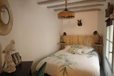 Un ou plusieurs lits dans un hébergement de l'établissement Maisonnette atypique en triplex au calme hyper-centre place du Ralliement