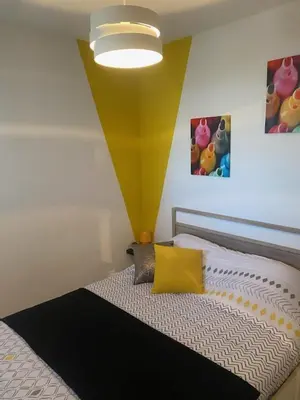 Un ou plusieurs lits dans un hébergement de l'établissement LA BIGEONNIERE Appartement 1 chambre résidence avec piscine proche centre