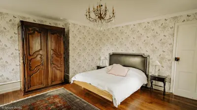 Un ou plusieurs lits dans un hébergement de l'établissement Chateau de la Preuille Gites