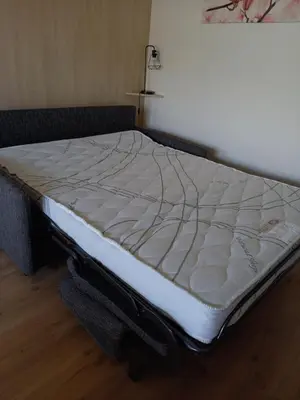 Un ou plusieurs lits dans un hébergement de l'établissement Gîte la petite maison