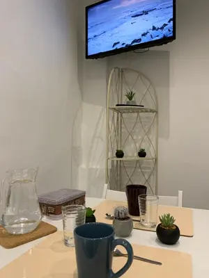 Télévision ou salle de divertissement dans l'établissement AZUR