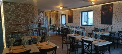 Restaurant ou autre lieu de restauration dans l'établissement Gîte de La Bicyclette