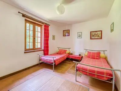 Un ou plusieurs lits dans un hébergement de l'établissement Quaint Holiday Home in Ferce