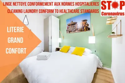 Un ou plusieurs lits dans un hébergement de l'établissement Gare / 2 chambres / Appartistic Machines de l île / WIFI FIBRE