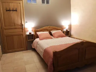 Un ou plusieurs lits dans un hébergement de l'établissement Gîte les genêts