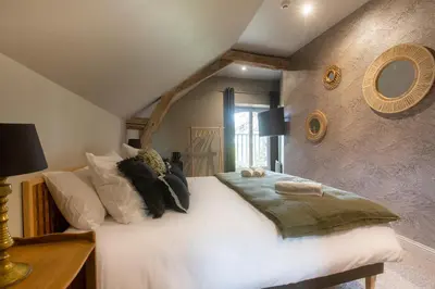 Un ou plusieurs lits dans un hébergement de l'établissement Le Château des Forges