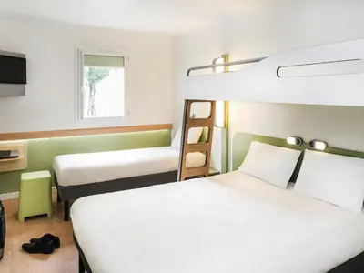 Un ou plusieurs lits dans un hébergement de l'établissement Hôtel Ibis Budget Nantes Nord St Herblain