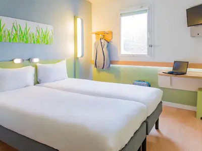Un ou plusieurs lits dans un hébergement de l'établissement Hôtel Ibis Budget Nantes Nord St Herblain
