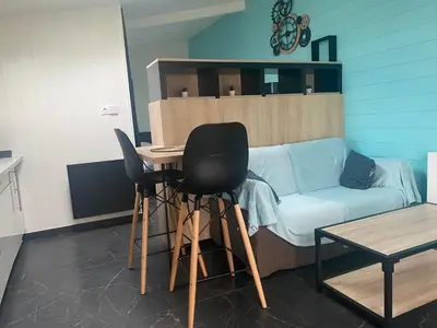 Coin salon dans l'établissement Jolie Maisonnette Studio