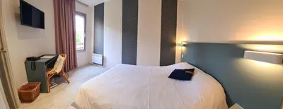 Un ou plusieurs lits dans un hébergement de l'établissement Hotel Pont De Senard