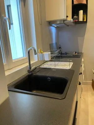 Cuisine ou kitchenette dans l'établissement Place au Repos
