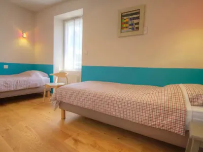 Un ou plusieurs lits dans un hébergement de l'établissement Gîte à proximité de la Loire avec Wi-Fi et équipement bébé - FR-1-306-814