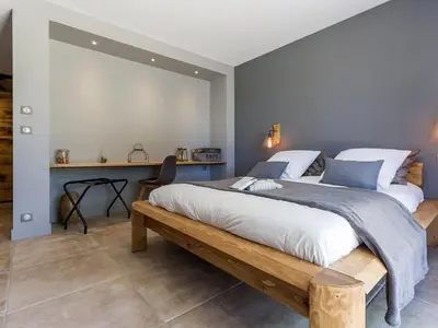 Un ou plusieurs lits dans un hébergement de l'établissement Villa Contemporaine avec Spa, Sauna, Piscine et Île Privative près de Nantes - FR-1-306-866