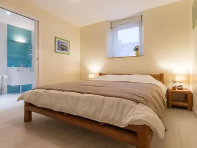 Un ou plusieurs lits dans un hébergement de l'établissement Gîte familial au calme avec étang privé, proche Nantes, jardin, activités, et accès PMR - FR-1-306-961