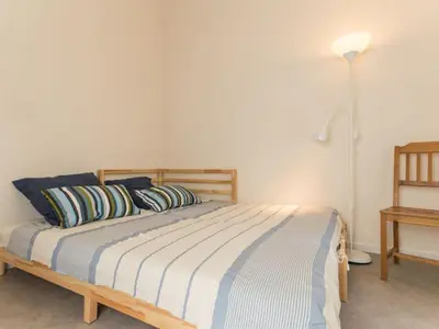 Un ou plusieurs lits dans un hébergement de l'établissement Maison lumineuse proche Nantes, jardin privatif, parking, Wi-Fi, cuisine équipée, équipements bébé - FR-1-306-1018