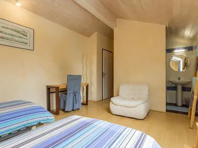 Un ou plusieurs lits dans un hébergement de l'établissement Ancien Bâtiment de Ferme Rénové entre Nantes et Pornic avec Jardin et Activités - FR-1-306-1028